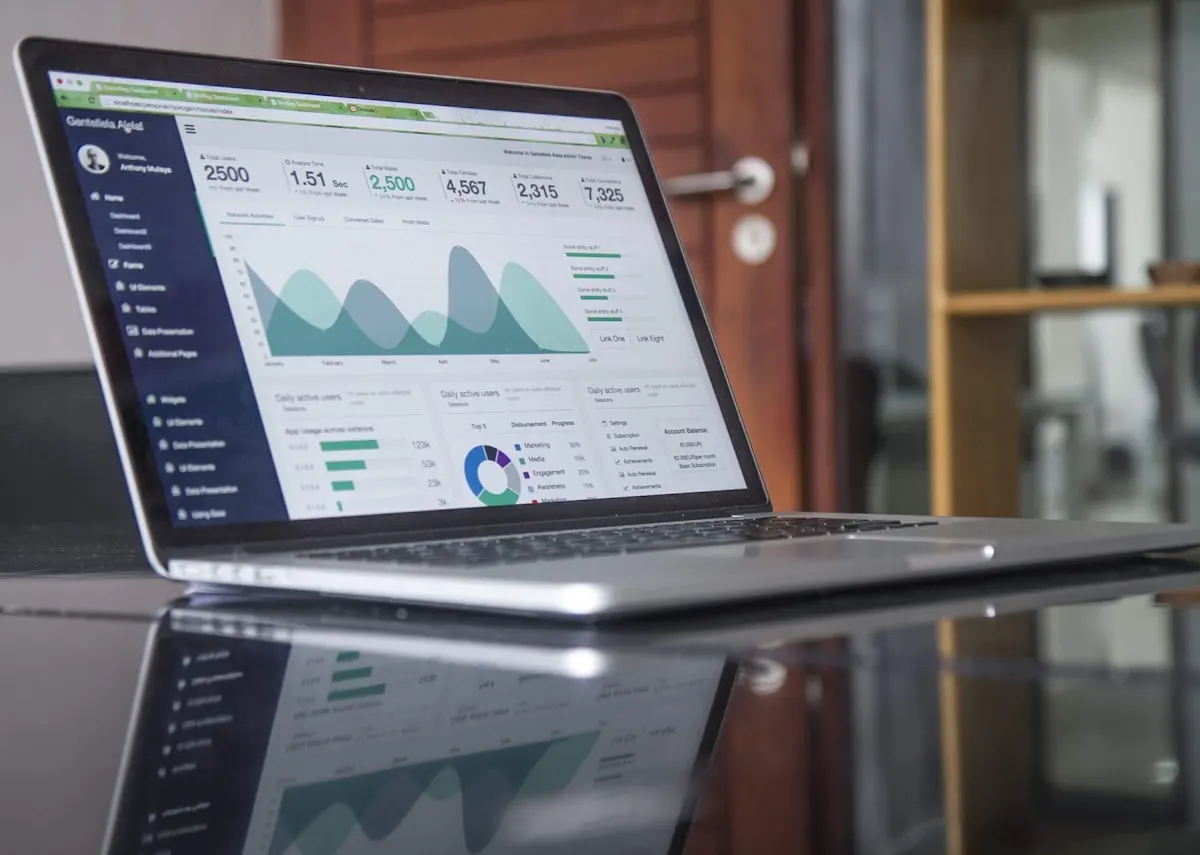 Laptop and business charts on a desk